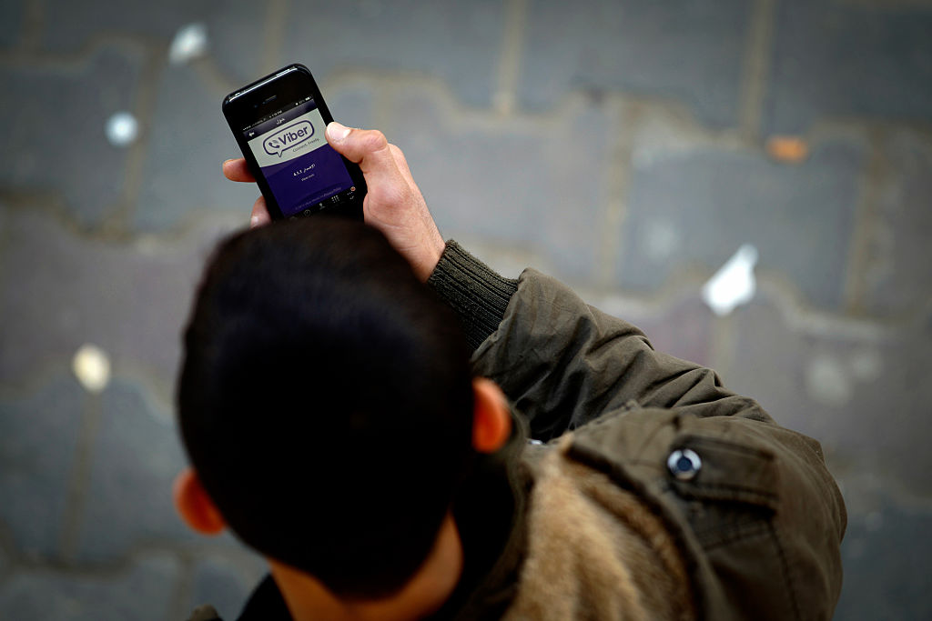 Viber screen Man using Viber app on phone